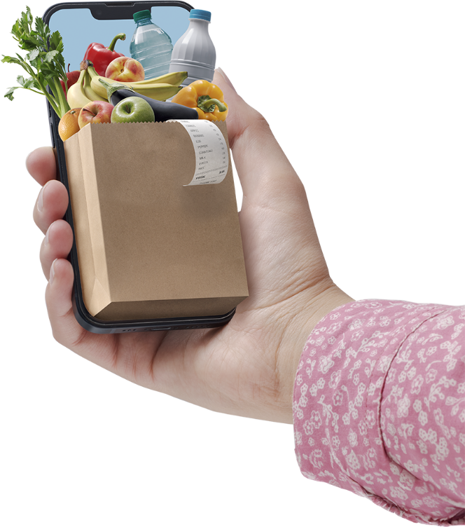 Image showing a woman's hand holding a smartphone with a miniature grocery bag overflowing with groceries.